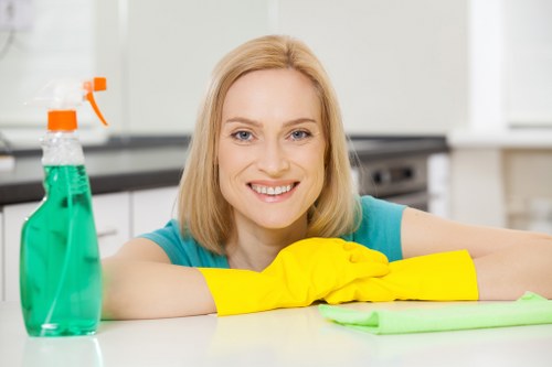 Cleaner working in a Bromley kitchen during a move out clean