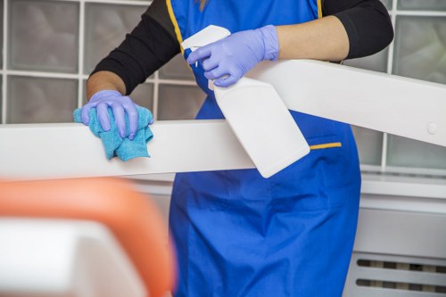 Professional using protective gear while handling cleaning products